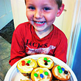 boy holding cupcakes