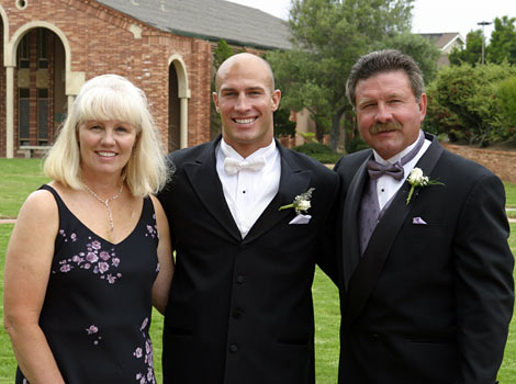 Eric with his mom and dad at wedding