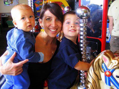 Jamie on merry-go-round with children