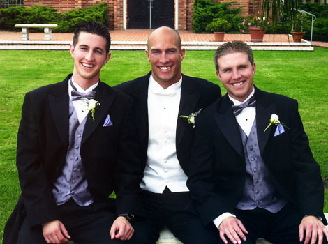 Eric and his two brothers at wedding