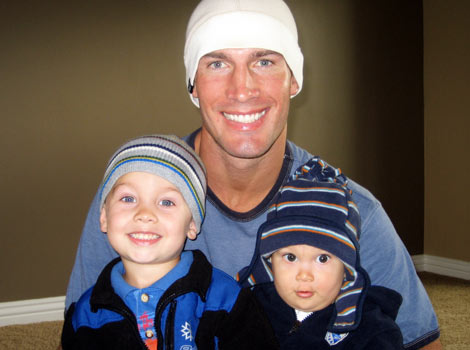 Father and sons in beanies