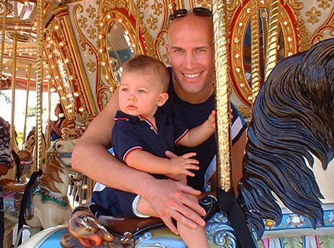 Eric and child on marry-go-round