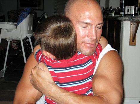 Eric hugging his son