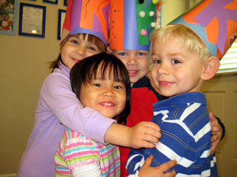 kids showing off their hats they made at daycare