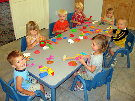 kids playing playdough at family daycare