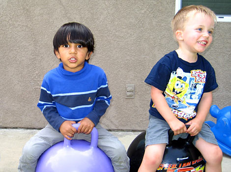 children bouncing on bouncy balls
