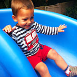 child sliding down slide