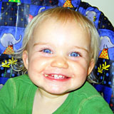 cute baby girl in high chair