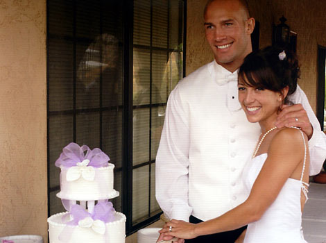 Jamie and Eric Watson cutting the cake