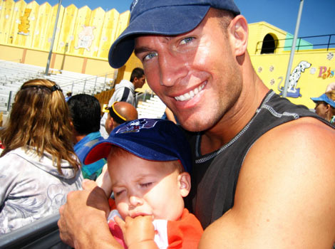 father holding sleeping baby